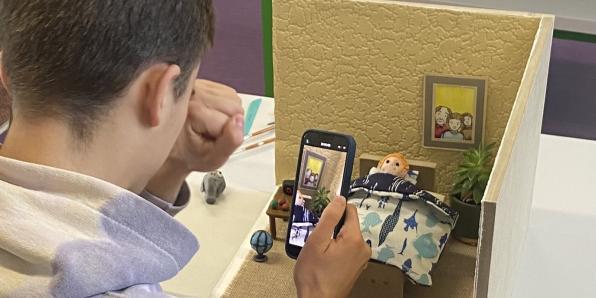 young person doing stop motion animation