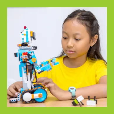 A photo of a girl with a LEGO reobot