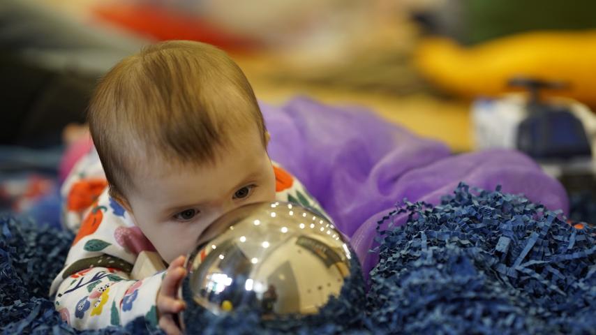 baby in sensory tray