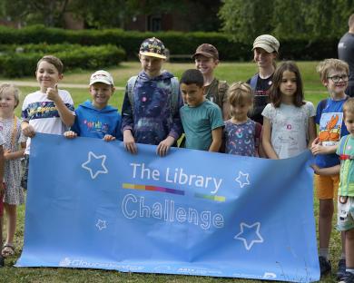 Children holding The Library Challenge banner